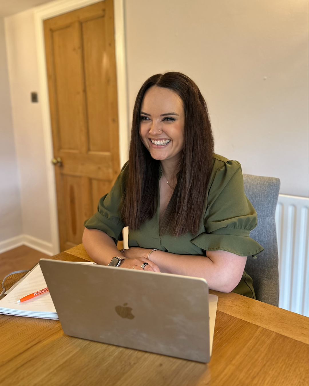 Gemma Price - Master Intuitive Psychology Coach - working at a laptop